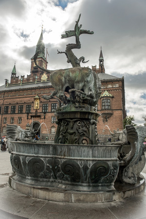 COPENHAGEN, DENMARK - Juny 26: Dragon Fountain, bull fighting a dragon, City Hall Square in Copenhagen on Juny 26, 2015 Copenhagen - capital and largest city of Denmarkのeditorial素材