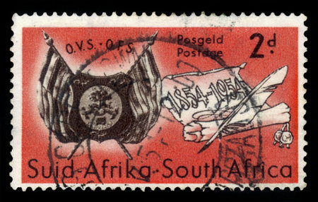 SOUTH AFRICA - CIRCA 1954: a stamp printed in South Africa shows coat of arms of Orange Free State and scroll, Orange Free State centenary, circa 1954のeditorial素材