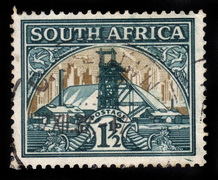 SOUTH AFRICA - CIRCA 1936: a stamp printed in South Africa shows gold mine, circa 1936のeditorial素材