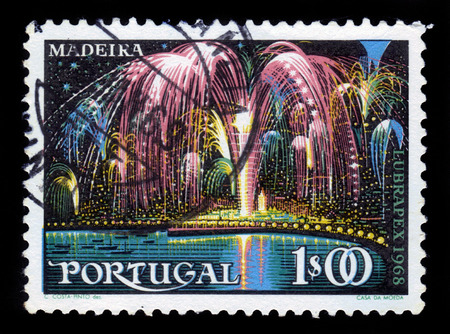 PORTUGAL - CIRCA 1968: A stamp printed in Portugal shows fireworks over Funchal on the island of Madeira, circa 1968のeditorial素材