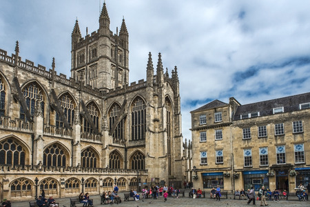 BATH, ENGLAND - JULY 28: tourists and locals enjoy a sunny day in the historic Bath Abbey and Roman Baths on July 28, 2015 in Bath, UK. Bath receives 4.5M visitors a yearのeditorial素材