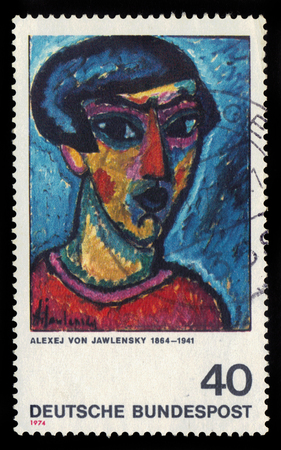 GERMANY - CIRCA 1974: postage stamp printed in Germany, shows head in blue, painting by Alexej von Jawlensky, russian expressionist, circa 1974のeditorial素材
