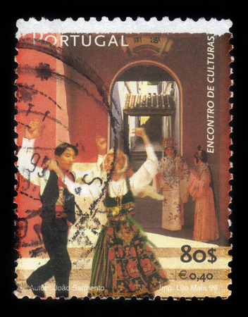 PORTUGAL - CIRCA 1999: a stamp printed in Portugal shows couple dancing on the streets of Macau during the art festival, circa 1999のeditorial素材