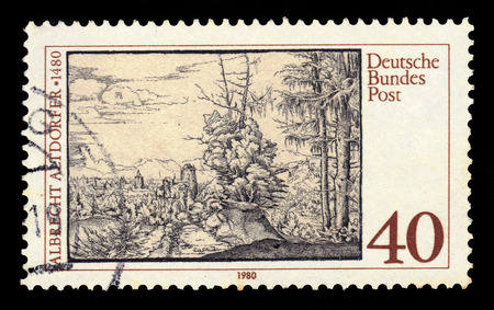 GERMANY - CIRCA 1980: a stamp printed in Germany shows landscape with fir trees by Albrecht Altdorfer, german painter and engraver, circa 1980のeditorial素材