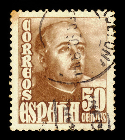SPAIN - CIRCA 1948: A stamp printed in Spain shows a portrait of General Francisco Franco (1892-1975), brown, series "Francisco Franco", circa 1948のeditorial素材