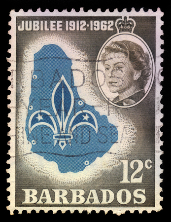 BARBADOS - CIRCA 1962: A stamp printed in Barbados shows emblem and map of Barbados and portrait of Queen Elizabeth II, circa 1962のeditorial素材