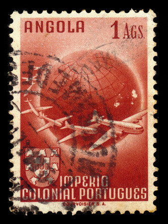 Angola - CIRCA 1949: a stamp printed in Portugal shows planes circling globe, series, circa 1949のeditorial素材