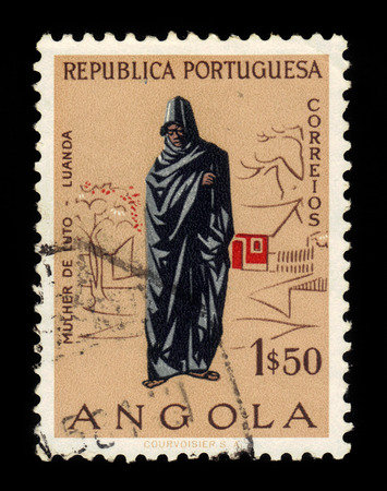 ANGOLA - CIRCA 1957: A stamp printed in Angola shows grieving woman, Luanda, series angolan people, circa 1957のeditorial素材