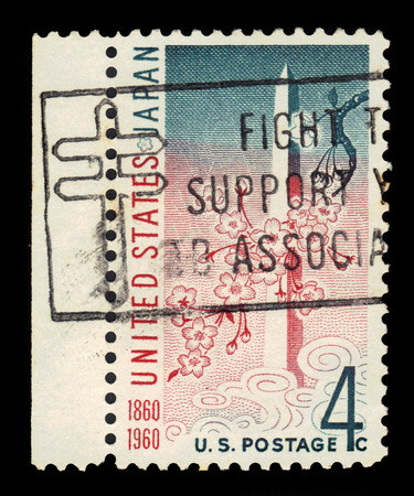USA - circa 1960: A stamp printed in United States of America shows Washington Monument and cherry ( sakura ) blossoms, USA-Japan treaty issue, circa 1960のeditorial素材
