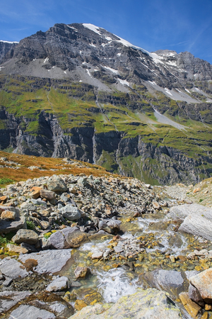 gorgeous summer landscape with a mountain stream in the Swiss Alps, Switzerlandの写真素材