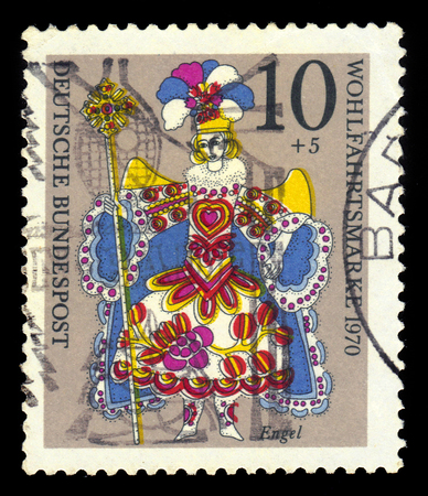 GERMANY - CIRCA 1970: A stamp printed in the Germany shows angel, Christmas doll, circa 1970のeditorial素材