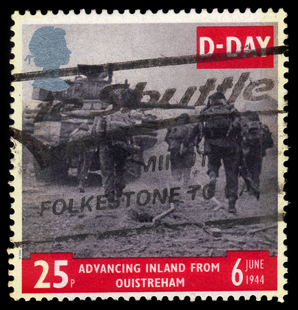 UNITED KINGDOM - CIRCA 1994: A stamp printed in Great Britain shows tank and infantry advancing from Ouistreham, 50th anniversary of D-Day, circa 1994のeditorial素材
