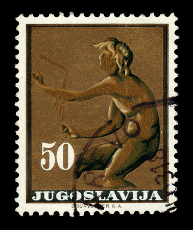Yugoslavia - CIRCA 1962: A stamp printed in Yugoslavia shows God Kairos (relief Trogir monastery) 300 BC, circa 1962のeditorial素材
