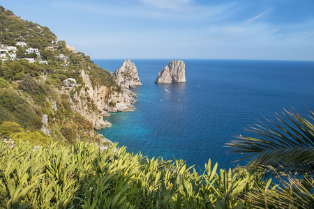 amazing Faraglioni cliffs panorama with the Tyrrhenian sea in background, Capri island, Campania region, Italyの写真素材