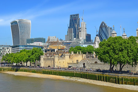 LONDON, ENGLAND - May 24,2017: Tower of London against the background of modern skyscrapers of...