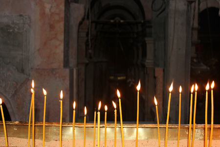 burning memorial candles in the templeの写真素材