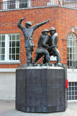 LONDON, ENGLAND - May 24,2017: national firefighters memorial by John W. Mills is a memorial composed of three bronze statues depicting firefighters in action, London, UKのeditorial素材