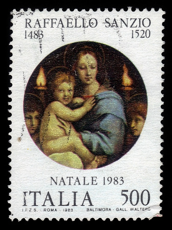 ITALIA - CIRCA 1983: A stamp printed in Italia shows Madonna and Child, painting by italian artist Raphael Sanzio, christmas, circa 1983のeditorial素材