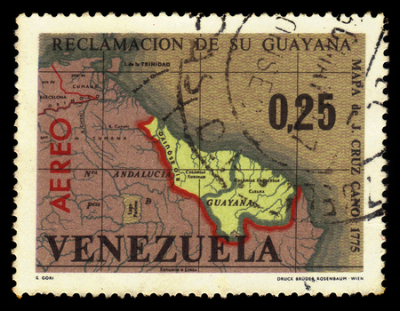 VENEZUELA - CIRCA 1965: A stamp printed in Venezuela shows map of Guayana Esequiba, territory administered by Guyana and claimed by Venezuela, circa 1965のeditorial素材