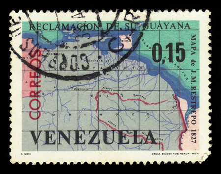 VENEZUELA - CIRCA 1965: A stamp printed in Venezuela shows map of Guayana Esequiba, territory administered by Guyana and claimed by Venezuela, circa 1965のeditorial素材