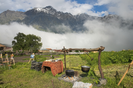 Gergeti, Georgia - 2017 June 16: outdoor Cafe in the high mountain village Gergeti, Georgia, Cafes, which serve national georgian food and you can buy paintings of local artistsのeditorial素材