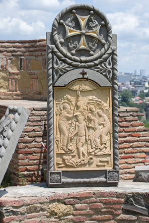 bas-relief in the courtyard of the Church of St. Nicholas on the territory of the ancient fortress Narikala, old Tbilisi, Georgiaの写真素材
