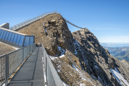 the world's first suspension bridge connecting two mountain peaks, Peak Walk at Glacier 3000 in Switzerlandの写真素材