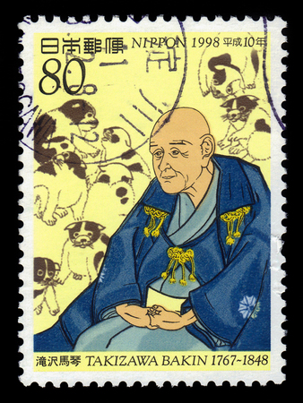 JAPAN - CIRCA 1998: A stamp printed in Japan shows Bakin Kyokutei (1767-1848), was a late japanese edo, period gesaku, circa 1998のeditorial素材