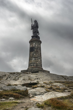 statue of Saint Bernard at the Great St Bernard Pass / Col du Grand-Saint-Bernard in the Swiss Alps, on the border between Italy and Switzerlandの写真素材
