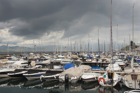 MONTREUX, SWITZERLAND - September 02: yacht parking on Montreux Riviera at Lake Geneva in the early morning on a cloudy day, Montreux, Switzerland on September 02, 2017のeditorial素材