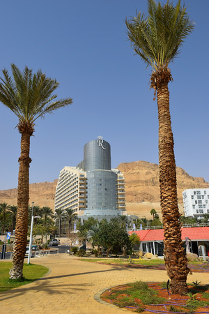 Dead Sea, Ein Bokek, Israel - october 19: landscape with palm trees on the background of luxury hotel, on october 19, 2017 in Ein Bokek, Dead Sea, Israeのeditorial素材