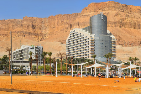 Dead Sea, Ein Bokek, Israel - october 19: vacationers and tourists bathe in the Dead Sea on the background of luxury hotels, on october 19, 2017 in Ein Bokek, Dead Sea, Israelのeditorial素材