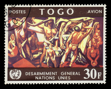 TOGO - CIRCA 1967: A stamp printed in Togo shows mural by spanish artist Jose Vela Zanetti in United Nations Conference Building, circa 1967のeditorial素材