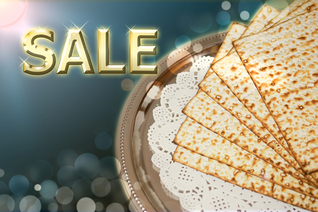 spring jewish holiday of Passover and its attributes, unleavened bread - matzo, with an inscription - saleの写真素材