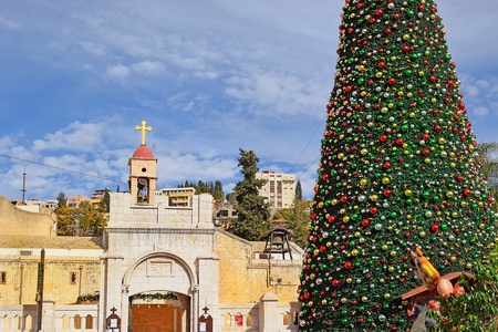 view of the Greek Orthodox Church of the Annunciation with Christmas decorations and a Christmas tree in Nazareth Israelの写真素材