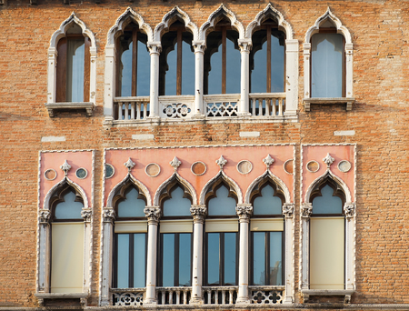 picturesque venetian windows with balconies, Venice, Italyの写真素材