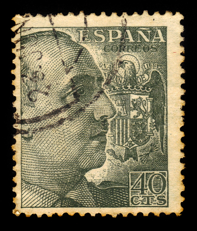 SPAIN - CIRCA 1939: a stamp printed in Spain shows portrait of General Francisco Franco, ruled over Spain as a military dictator from 1939, after the nationalist victory in the Spanish Civil War, until his death in 1975, black green, circa 1939のeditorial素材