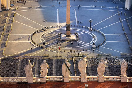 view of St. Peter's Square and statues of the apostles on the roof of St. Peter's Basilica from the height of the dome of St. Peter's Cathedral, Vatican, Rome, Italyの写真素材