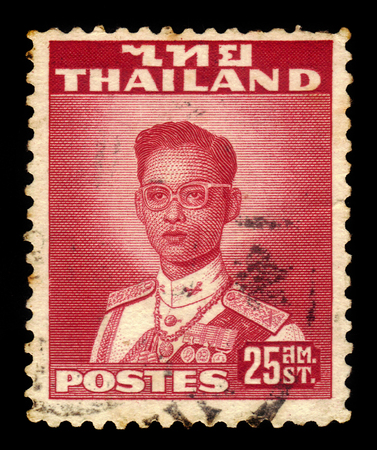 Thailand - CIRCA 1961: A stamp printed in Thailand shows King Bhumibol Adulyadej, King of Thailand ( King Rama IX ), circa 1961のeditorial素材