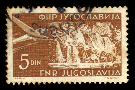 YUGOSLAVIA - CIRCA 1952: A stamp printed in Yugoslavia shows Plitvice waterfall in Plitvice Lakes National Park, central Croatia, circa 1952のeditorial素材