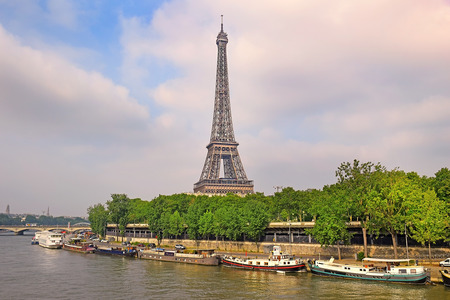 view of the Eiffel Tower from the river Seine in Paris, Eiffel Tower most visited monument in France and the most famous symbol of Parisの写真素材