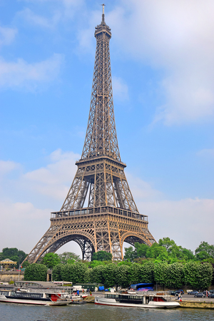 view of the Eiffel Tower from the river Seine in Paris, Eiffel Tower most visited monument in France and the most famous symbol of Parisの写真素材