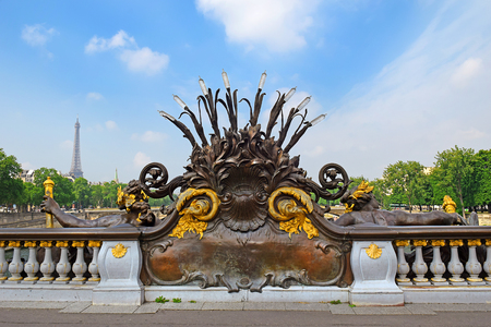 Pont Alexandre III bridge decorated with ornate Art Nouveau lamps and sculptures and Eiffel Tower in the distance, Paris, Franceのeditorial素材