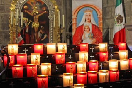 burning memorial candles at Notre Dame de Paris Cathedral in Paris, Franceのeditorial素材