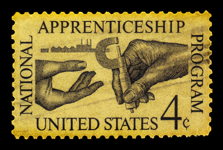UNITED STATES - CIRCA 1962: A stamp printed in USA symbolizes the transfer of knowledge (micrometer) with inscription  "National Apprenticeship Program", apprenticeship Issue, circa 1962のeditorial素材