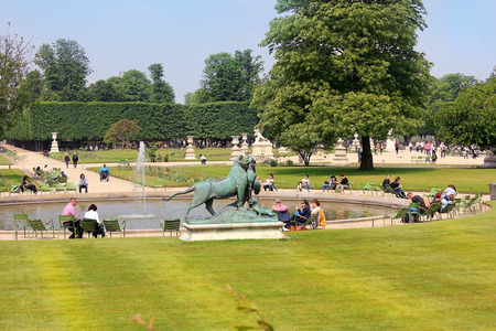 PARIS, FRANCE -23 may 2018: local residents and tourists in famous Tuileries garden. Tuileries Garden (Jardin des Tuileries) is a public garden located between the Louvre Museum and the Place de la Concordeのeditorial素材
