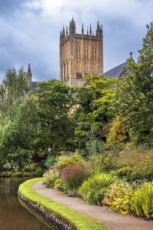 Wells Cathedral (Cathedral Church of Saint Andrew), Wells Abbey and park on sunny day, Somerset, Englandのeditorial素材