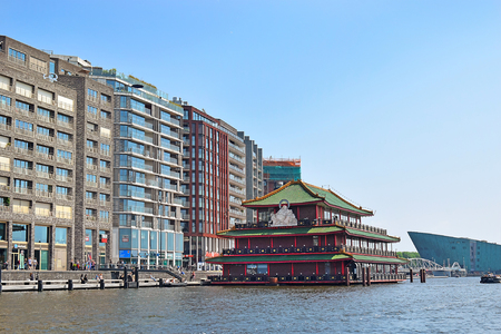 Amsterdam, North Holland, The Netherlands - May 20 2018: famous floating Chinese restaurant Sea Palace styled as a pagoda, biggest Chinese restaurant in Europe, view from River IJのeditorial素材