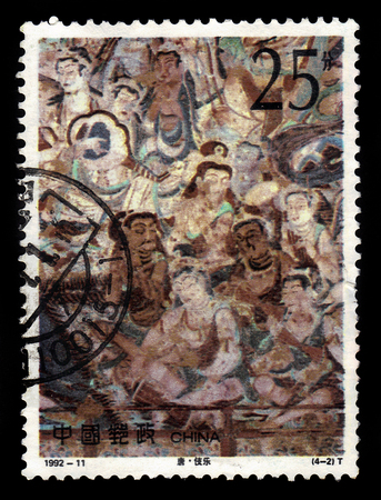 CHINA - CIRCA 1992: A stamp printed in China shows ancient frescoes in the Mogao Caves, also known as the Thousand Buddha Grottoes or Caves of the Thousand Buddhas, Dunhuang, Gansu, China, circa 1992のeditorial素材