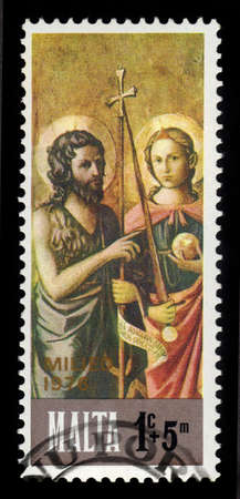 Malta - CIRCA 1976: A stamp printed in Malta shows St. John the Baptist and St. Michael, bible scene, painting by italian painter of the florentine school Domenico di Michelino, series Christmas, circa 1976のeditorial素材